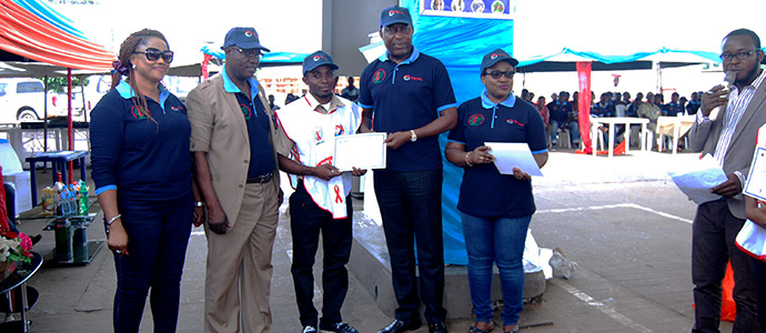 A trained Peer Educator Receiving his certificate